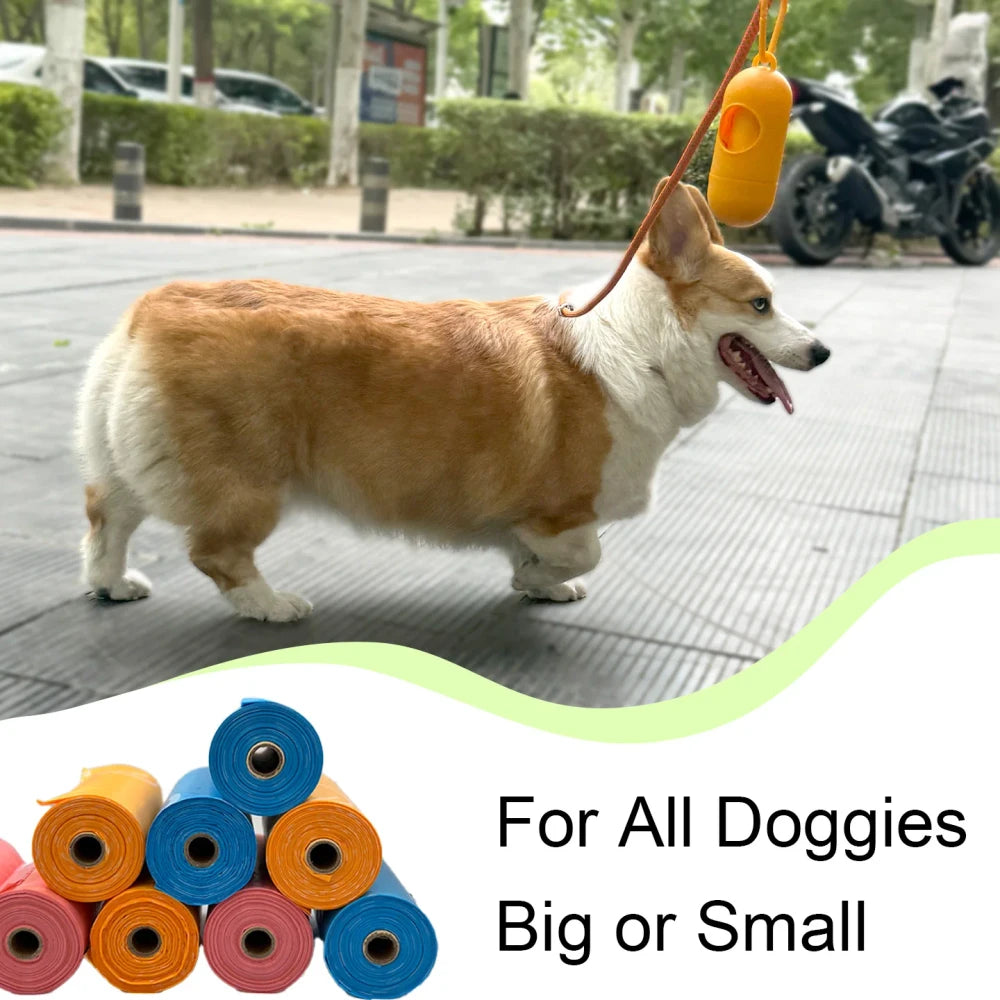 Perro corgi paseando junto a los rollos de bolsas para excrementos AMIKART