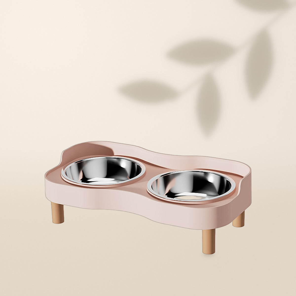 Comedero elevado doble AMIKART en rosa con dos cuencos de acero inoxidable, sobre fondo crema